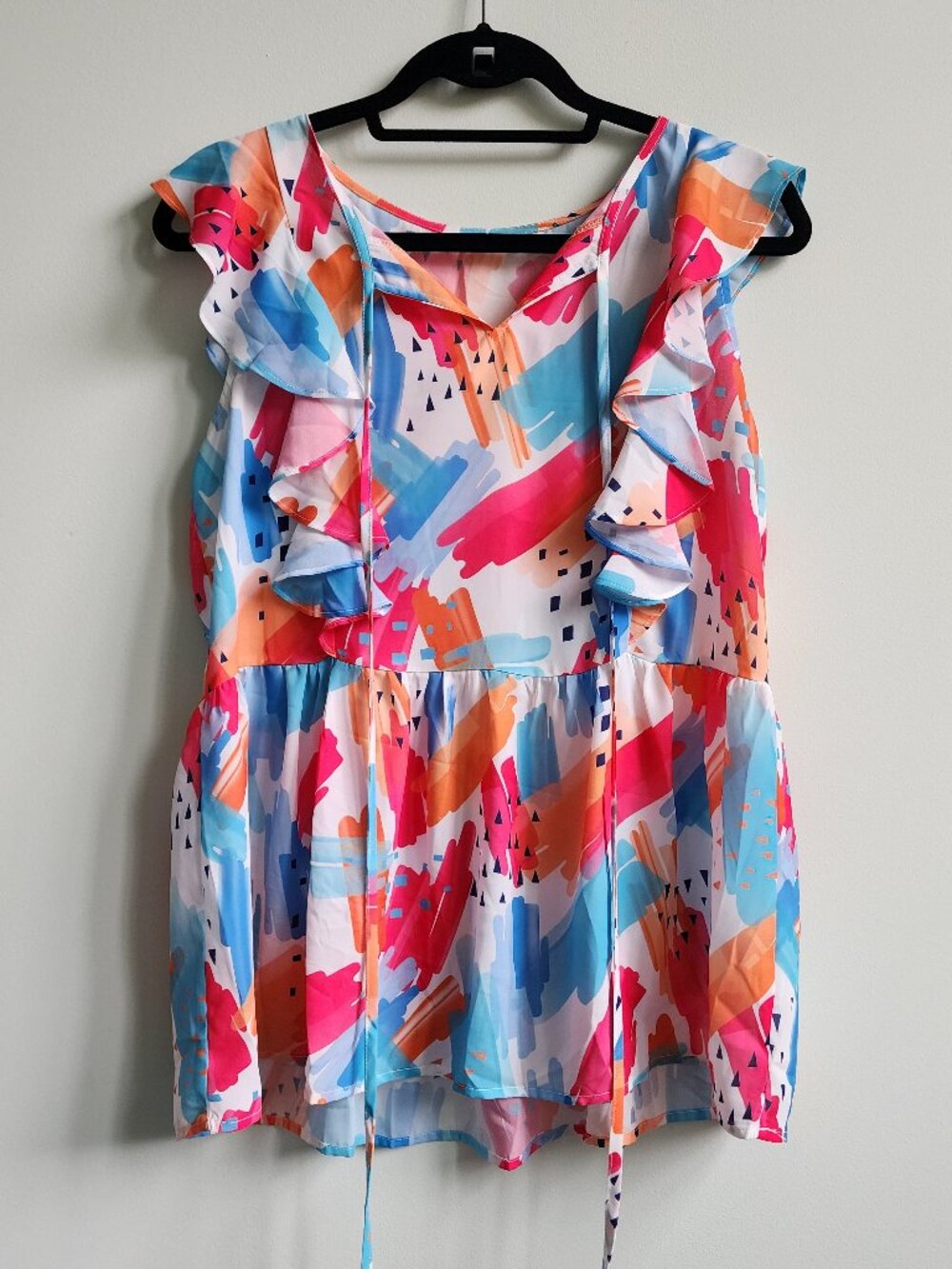 Size M Bright Abstract Print Sleeveless Peplum Top with Flutter Detail